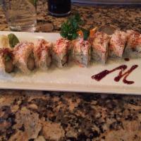 Snow Mountain Maki · Real crab meat mixed with light mayo sauce with shrimp tempura and avocado with coconut flak...