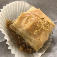 Baklava · A flakey pastry served with walnuts cinnamon sugar and homemade syrup