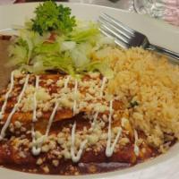 Cheese Enchiladas · 2 corn tortilla enchiladas filled with cheddar cheese and topped with red sauce. Served with...