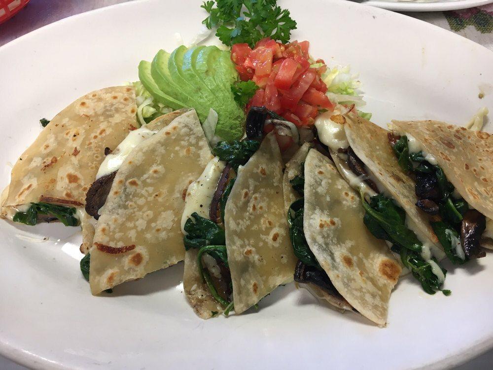 Quesadillas · Served with pico de gallo guacamole and sour cream.