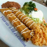 Flautas · 2 chicken or beef flautas. Served with rice, beans, sour cream and guacamole salad.