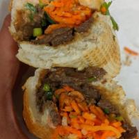 Grilled Beef Sandwich · Pickled carrots and daikon, cucumber, green onions, cilantro, jalapeno, and mayo.