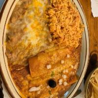 Enchiladas · Two enchiladas with your choice of beef, chicken, or cheese garnished with guacamole, and so...