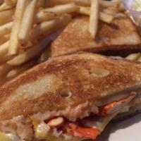 Lobster Grilled Cheese Sandwich · Maine lobster, mozzarella, American, cheddar and Monterey Jack with frizzled onions on grill...