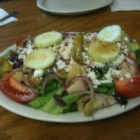Greek Salad · Tomato, onion, artichoke hearts, cucumber, Greek Kalamata olives, pepperoncini, and feta che...