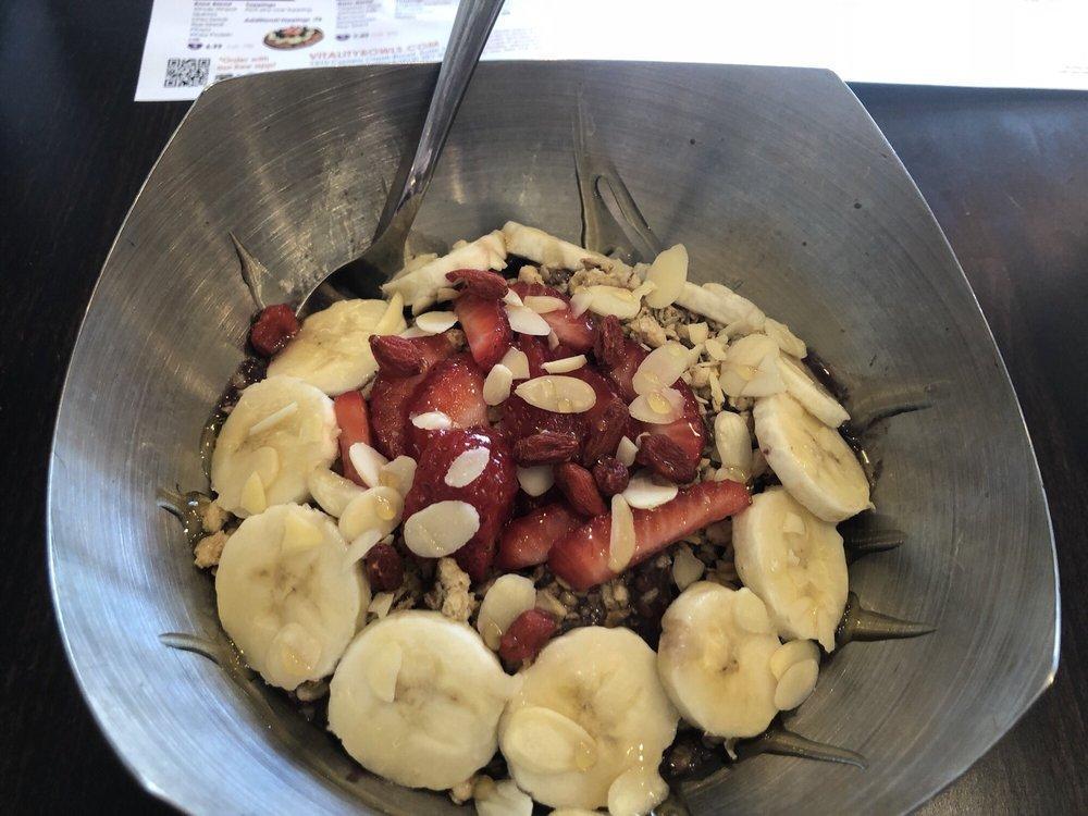 Warrior Bowl · Base blend of organic acai, VB blend, almond milk, bananas, blueberries, raspberries, flax seed, broccoli and a multi-vitamin boost. Topped with organic granola, bananas, strawberries, almonds, goji berries, and honey.