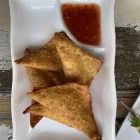 Crab Rangoon · Deep fried wonton wrappers filled with cream cheese and real crab meat.