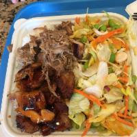 Kalua Pork with Cabbage · Slow roasted pork with a hint of smoky flavor, served shredded over steamed cabbage. Hawaii’...
