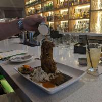 Cochinita Pibil · All-natural achiote-marinated braised pork shank with lemongrass rice, oregano-pickled red o...