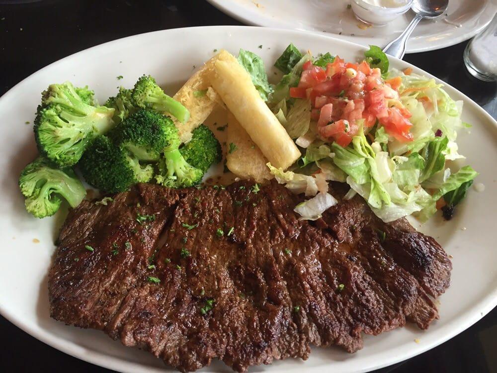 Carne Asada · A delicious 10 oz. wood grilled sirloin flap steak, marinated with our secret spices. Served with white rice, french fries and salad.