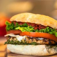 Tuscan Chicken Sandwich · Marinated and grilled boneless, skinless chicken breast with Asiago cheese, Tuscan spread, p...