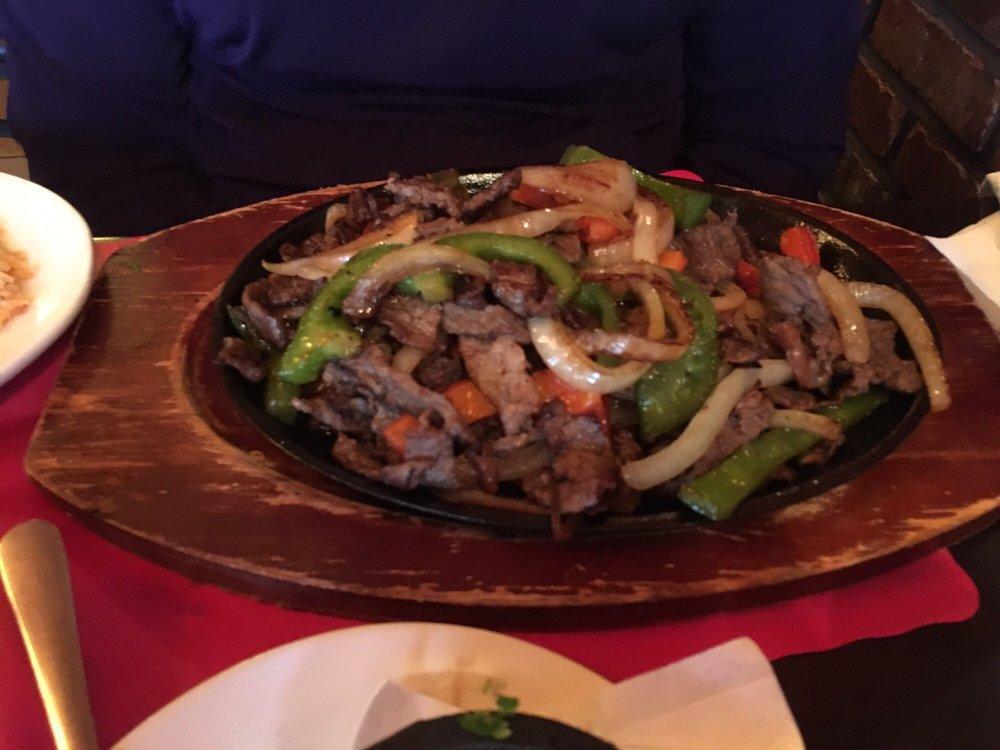 Fajitas · Sauteed with onions peppers served on a sizzling platter. Servidos con arroz, frijoles y tortillas de maiz o harina. Served with rice, beans, and corn or flour tortillas.
