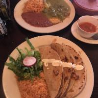 Huevos Rancheros Desayunos · Green sauce and cactus strips.