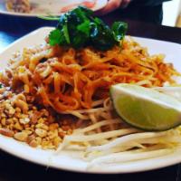 Pad Thai · Rice noodle stir fried with bean sprouts, egg and dried chili. Topped with cilantro and pean...