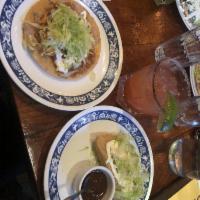 Tostada · Avocado or chicken tinga with refried beans, lettuce, queso and crema with chipotle salsa, c...