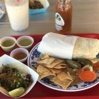 Asada Burrito · Steak, rice, beans, onion, cilantro, and spicy salsa.