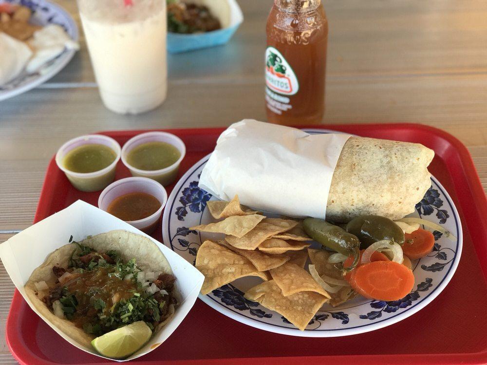 Asada Burrito · Steak, rice, beans, onion, cilantro, and spicy salsa.