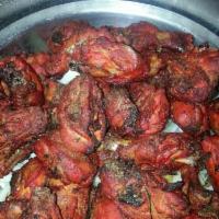 Tandoori Chicken · Bone-in spring chicken, marinated in yogurt, lemon juice, ginger, garlic and mild spices and...