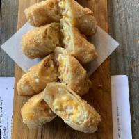 8 Pieces Bacon Mac and Cheese Egg Rolls · Ditalini pasta, jack and cheddar queso and bacon! Served with monterey jack and cheddar chee...
