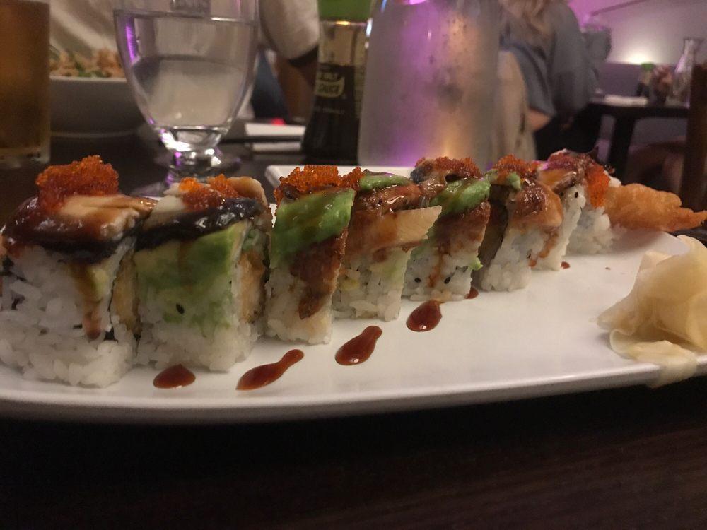 Green Monster Roll · Inside: shrimp tempura, cucumber. On top unagi, avocado, tobiko, eel and sauce. 