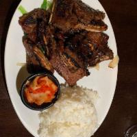 Korean BBQ Galbi · Prime beef short ribs with bones, marinated in a traditional Korean recipe and seared to per...