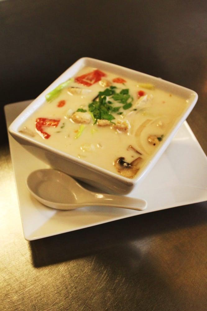 Tom Kha · Coconut soup with lemongrass, galangal, carrot, cabbage, mushroom, onion, cilantro, and kaffir lime leaves.
