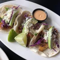 Fish Tacos · Three corn or flour tortillas with white fish or shrimp. Topped with purple cabbage, pico de...