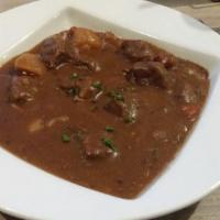 Guinness Beef Stew · Braised beef, carrots, potatoes, 
onions, Guinness gravy