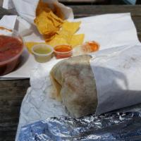 Fajitas Burrito · Choice of carne with grilled veggies, cheese, refried beans, rice and guacamole.