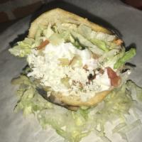 Gordita · Yellow corn masa cake filled with your choice of protein, refried or black beans, lettuce, t...