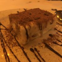 Tiramisu · Layers of lady finger cookies soaked in espresso cofee with a mascarpone cream. Dusted with ...