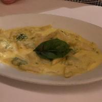 Ravioli Zafferano · Homemade ravioli filled with ricotta and spinach in a creamy saffron sage sauce. Vegetarian.