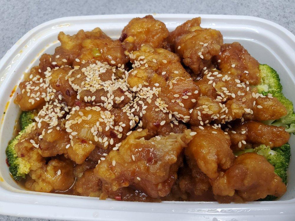 Sesame Chicken · Chunks of chicken stir-fried with our chef's sesame seed and hot garlic sauce. Hot and spicy.