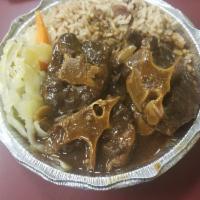 Oxtail · Served with Rice and Peas or White Rice and Choice of Cabbage or Plantains.