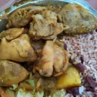Curry Chicken · Served with Rice and Peas or White Rice and Choice of Cabbage or Plantains.