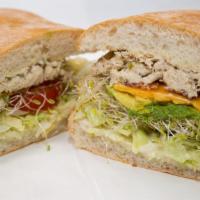 Tuna Salad Sandwich · Tuna salad, lettuce and tomato on sliced bread.