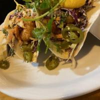 Shrimp Tacos · 3 delicious, lightly breaded shrimp tacos in your choice of tortillas filled with chipotle c...