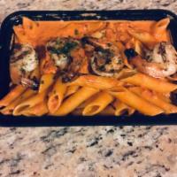Penne Alla Vodka · Penne in a light pink, cream sauce with a touch of vodka. Garnished with parmigiano cheese a...