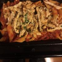 Penne Arrabiata · A zesty combination of garlic and hot peppers in a basil marinara sauce. Garnished with parm...