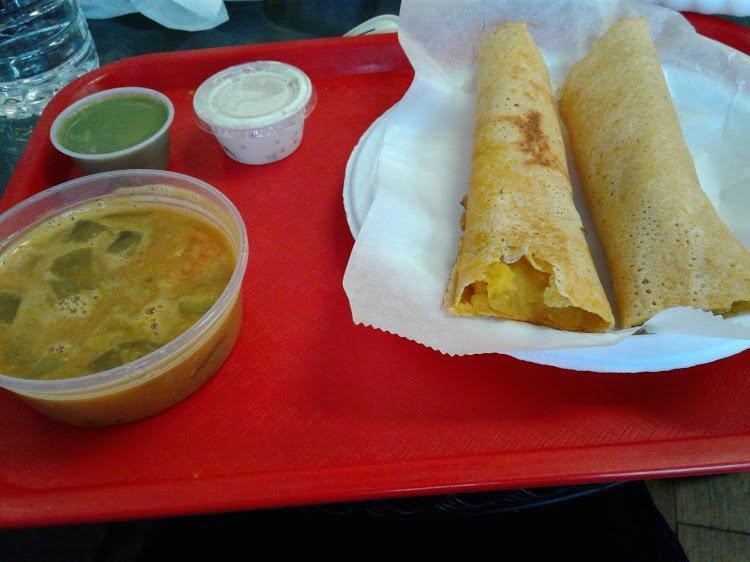 Masala Dosa · Thin fermented rice pancake stuffed with potato mash, served with spicy lentil soup and coconut chutney.