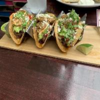 Surf & Turf Tacos · Short ribs and shrimp, chipotle aioli, guacamole, pico de gallo and queso fresco. 