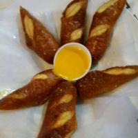 Hot Soft Pretzels · 6 pieces steaming hot right out of the oven with sea salt and a side of queso. Great starter...