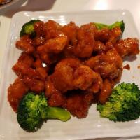 Orange Chicken · Tender crispy chicken glazed with sweet tangy orange sauce. Served with rice.