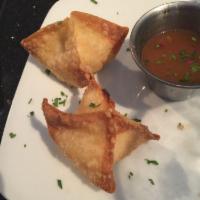 Crab Rangoons · Real crab and a cream cheese mix in crispy wonton wrappers. Served with a Hawaiian sauce.