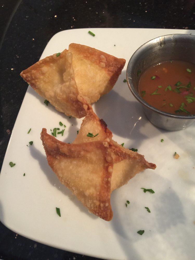 Crab Rangoons · Real crab and a cream cheese mix in crispy wonton wrappers. Served with a Hawaiian sauce.