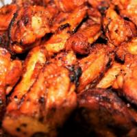 Buffalo Wings · Delicious Buffalo Wings, Double Marinated, Baked to Perfection, Served with Our Home Made Ra...