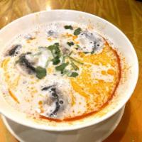 Tom Kha Soup · A creamy smooth spicy coconut milk with mushrooms. Mild spicy.