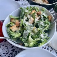 Caesar Salad · Romaine lettuce, garlic croutons, Parmesan cheese and homemade dressing. Add protein for an ...