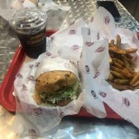 Bullseye BBQ Burger · Crispy onions straws, bacon, BBQ sauce, Cheddar, lettuce, tomato, and mayonnaise on a Miami ...