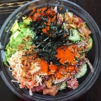 Tuna Lover Bowl · Ahi tuna, spicy tuna, albacore tuna, mango, cucumber, green onion, and sweet onion, mixed wi...